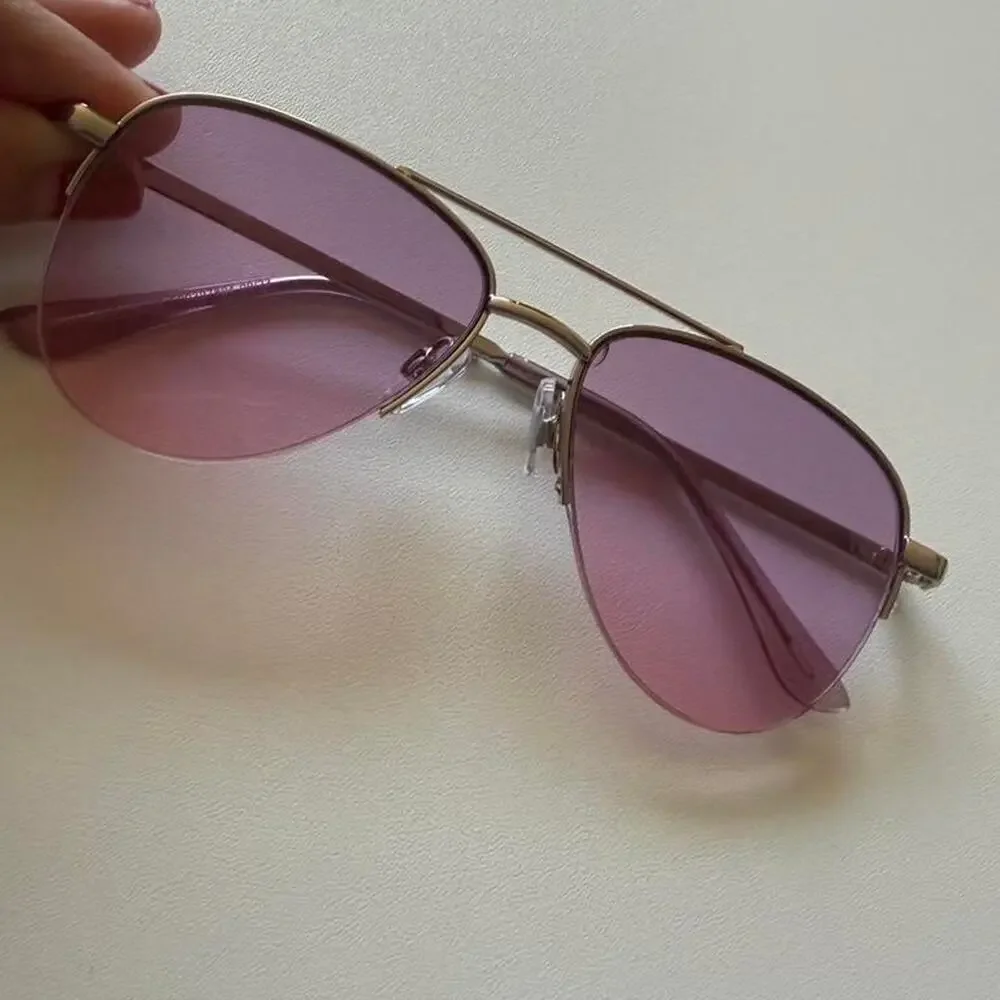 Gold aviator sunglasses with purple